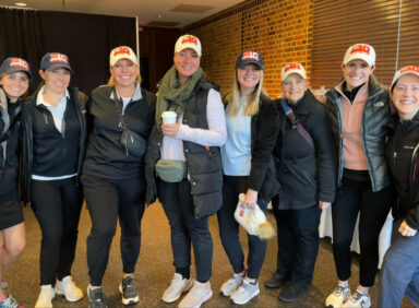 Employees wearing University of Illinois ballcaps